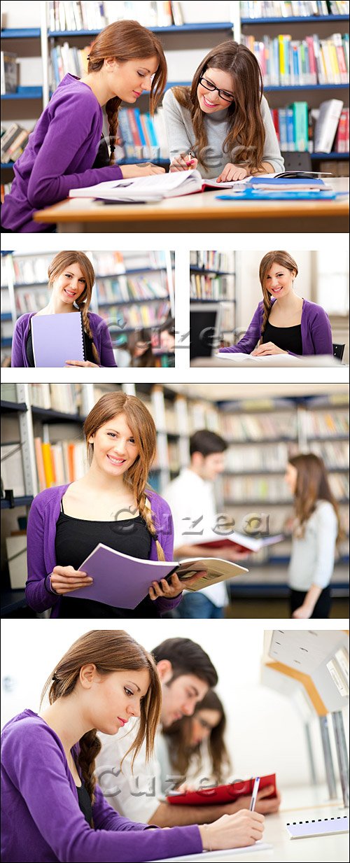    / Young students studying in a library - Stock photo