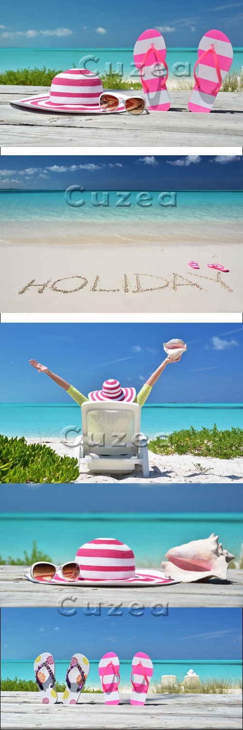   / HOLIDAY writing on the sandy beach - stock photo