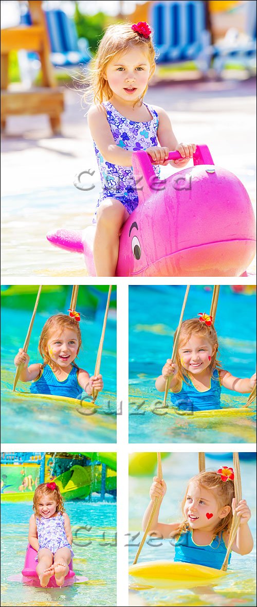    / Happy girl on water attractions - stock photo