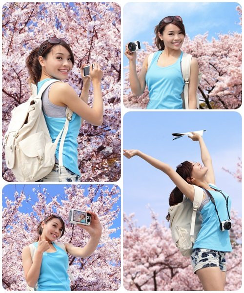 Girl with camera near the spring tree - stock photo